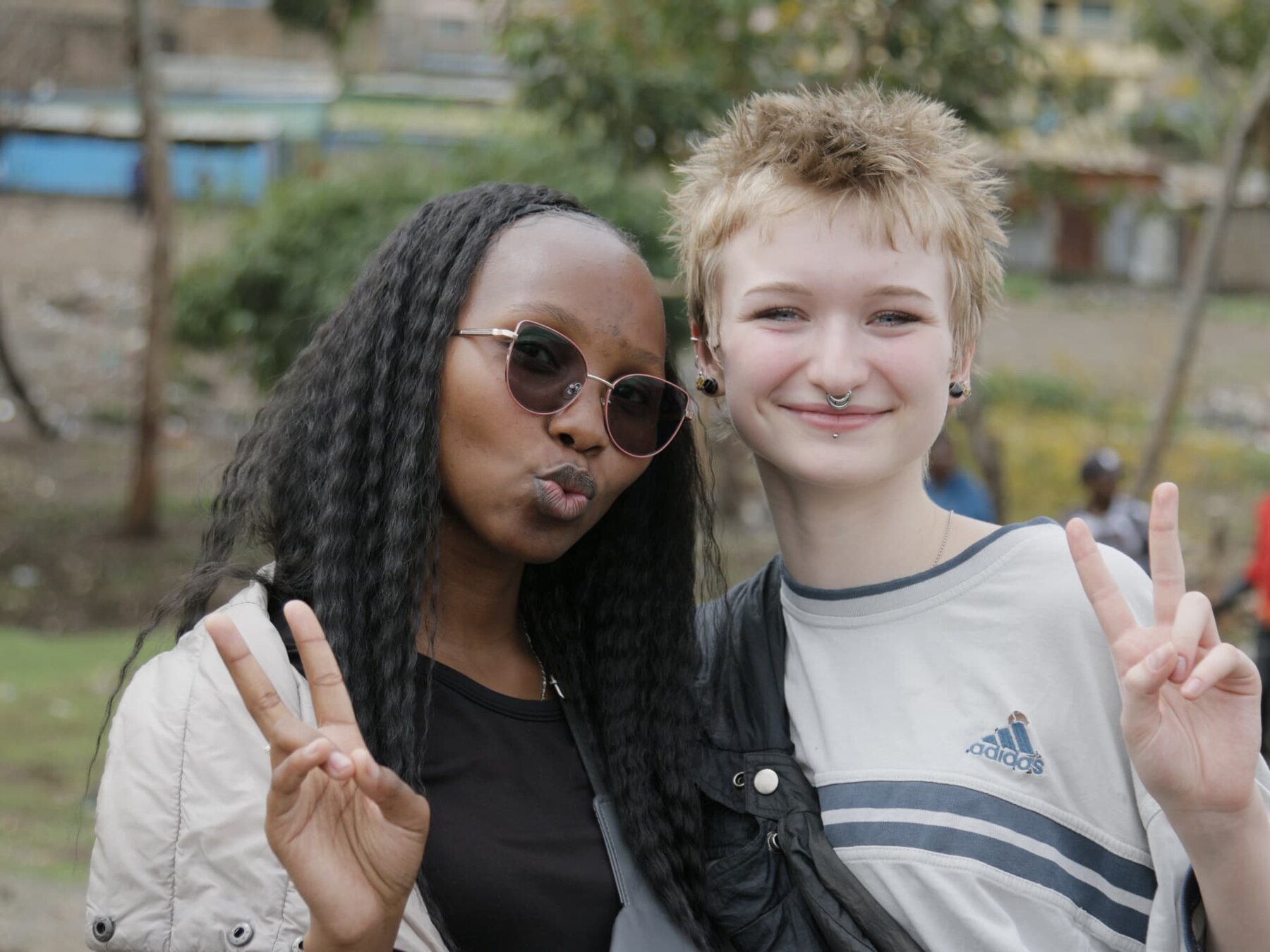 Two young people standing together outdoors