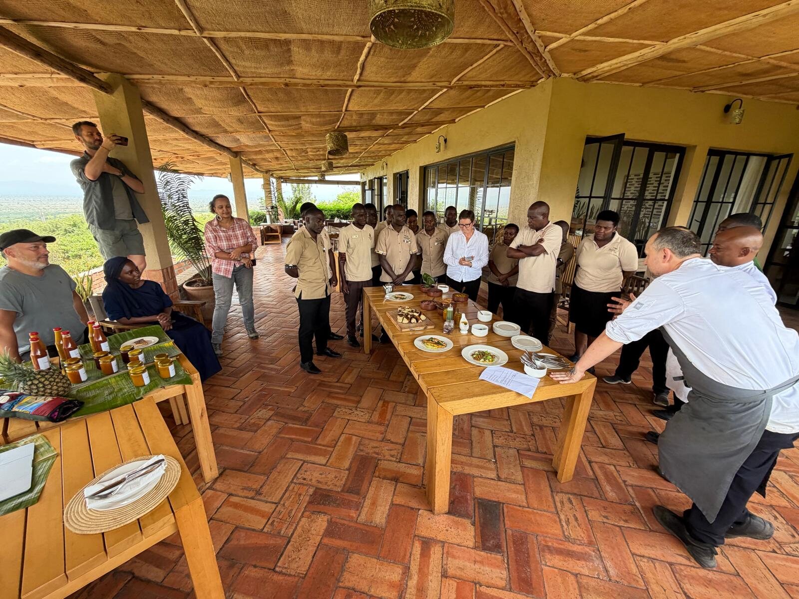 Briefing and product tasting on a lodge terrace in Uganda